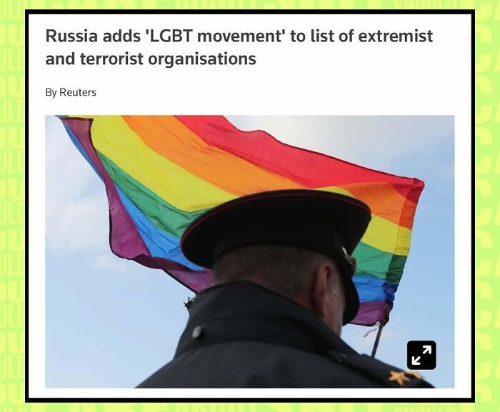 Police officer standing under a rainbow flag with headline about Russia labeling the LGBT movement as extremist.