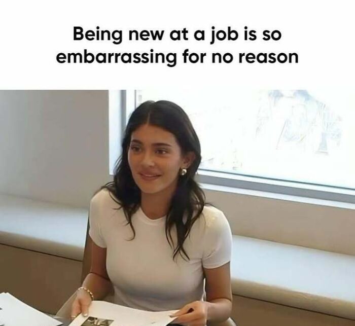 "Woman at desk holds papers, showcasing 'sadcastic' meme humor on job-related embarrassment."