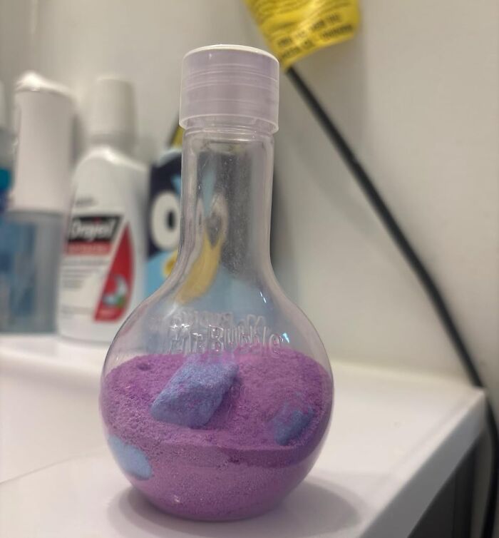 Purple bath powder in a unique bottle, perfect Easter basket stuffer to make candy look boring.