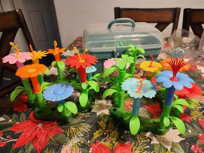 Colorful plastic flower toys on a festive table, perfect for creative Easter basket stuffers.