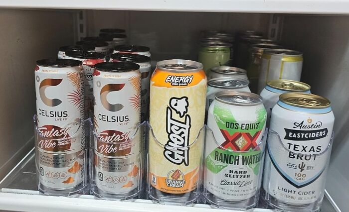 Costco a*******n: Various energy drinks and beverages neatly arranged on a store shelf.