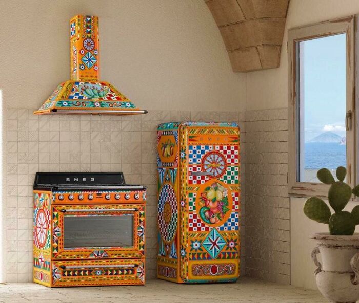 Colorful vintage kitchen appliances with intricate patterns in a Mediterranean interior showing poorly-aging interior design trends.