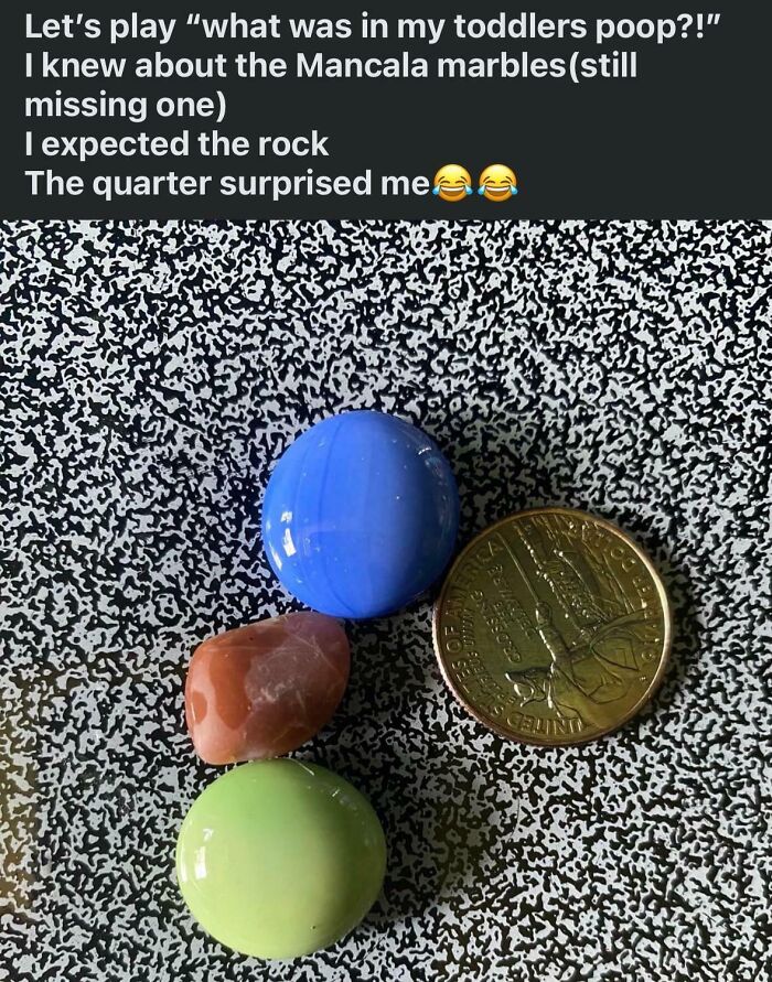Mancala marbles, rock, and quarter on a patterned surface, related to funny mom group stories.