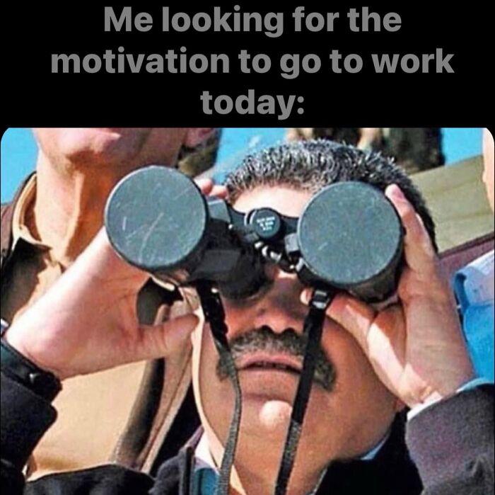 Man using binoculars humorously searching for work motivation, representing a funny work meme.