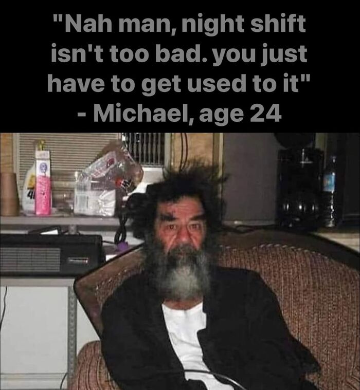 Scruffy man with beard sitting on sofa, caption jokes about night shift; funny work meme on burnout.