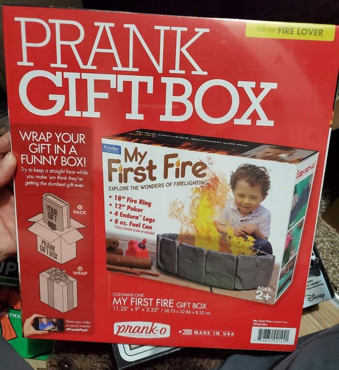 Prank gift box featuring a fake toy fire set, designed for humorous gifting.