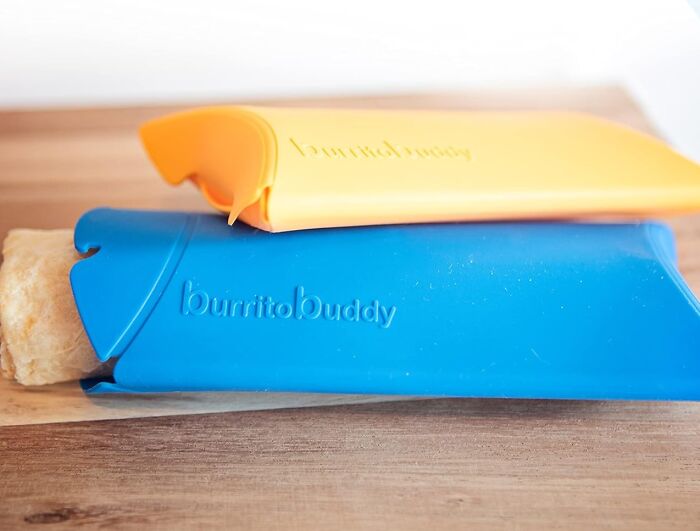 Colorful silicone food holders for Amazon finds, labeled "Burrito Buddy," on a wooden surface.