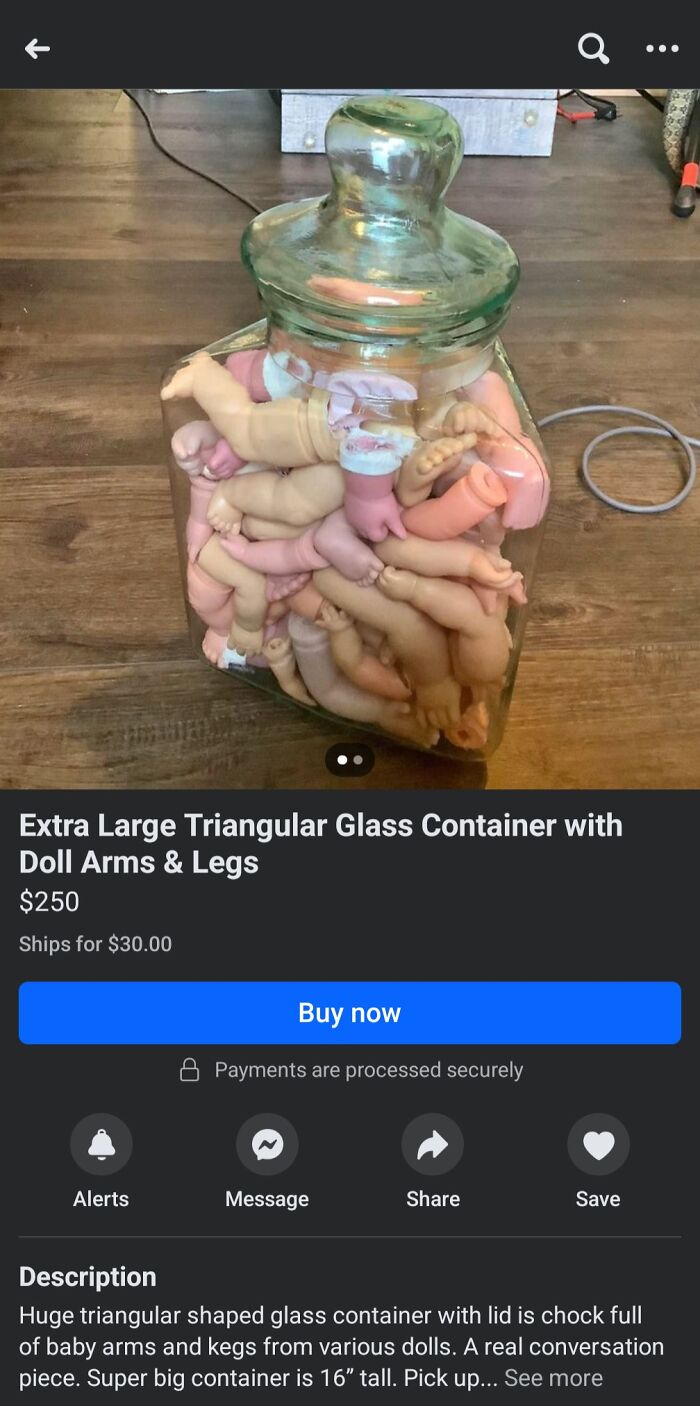 Large glass jar full of doll parts for sale on Facebook Marketplace.