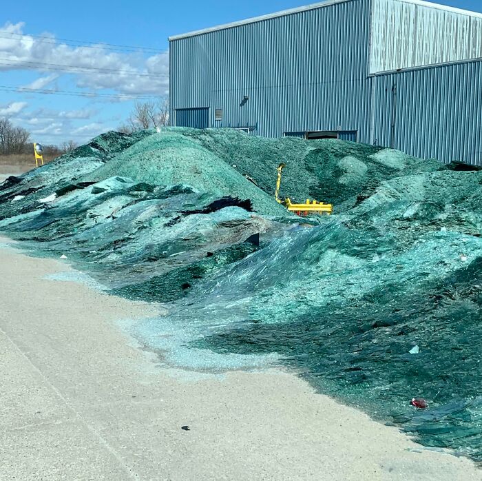 Piles of blue-green glass shards outside a factory show a fascinating aspect of our world's diversity.