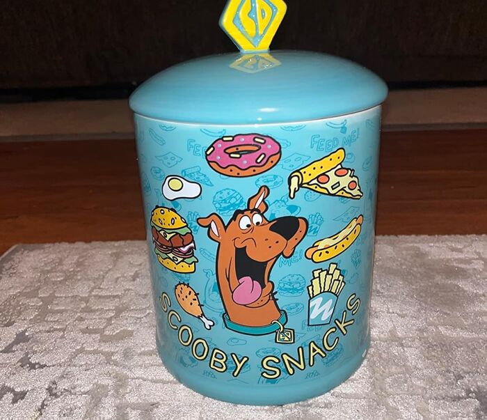 Blue Scooby Snacks jar with fun food graphics, perfect for fandom enthusiasts.