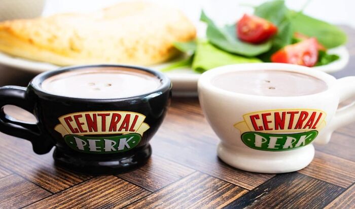 Central Perk-themed mugs on a wooden table, set for pure fandom goals.
