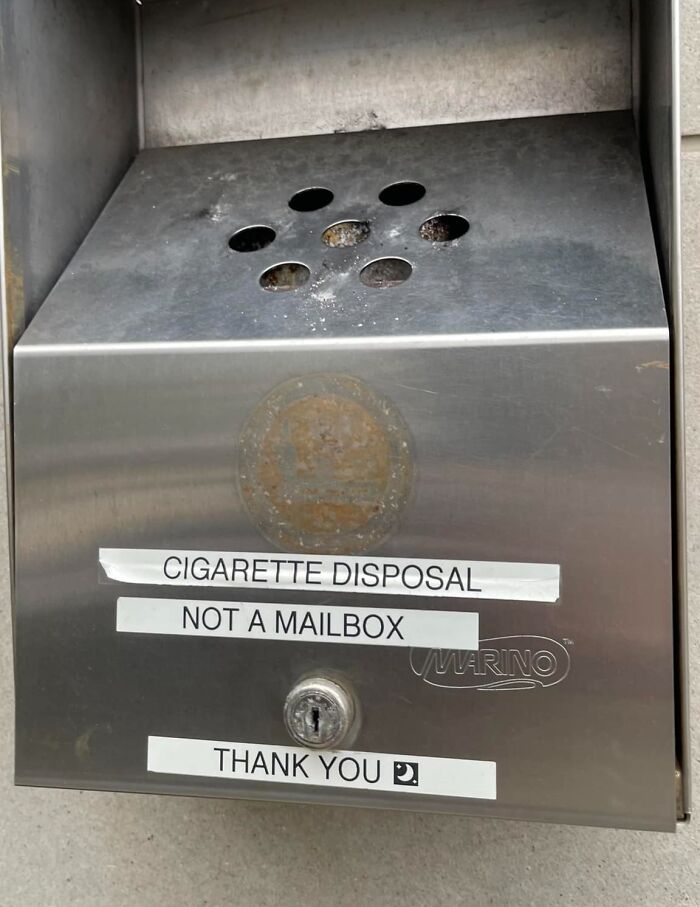 Cigarette disposal labeled "Not a Mailbox," highlighting a common big mistake in public areas.