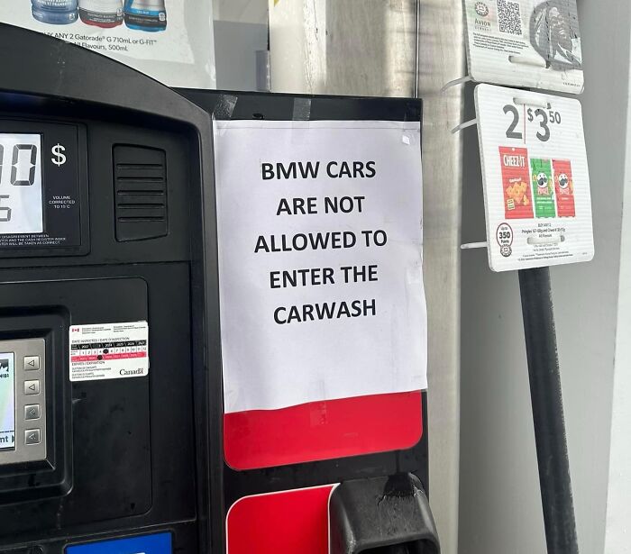 Sign stating BMW cars banned from entering the carwash, hinting at potential mistakes.