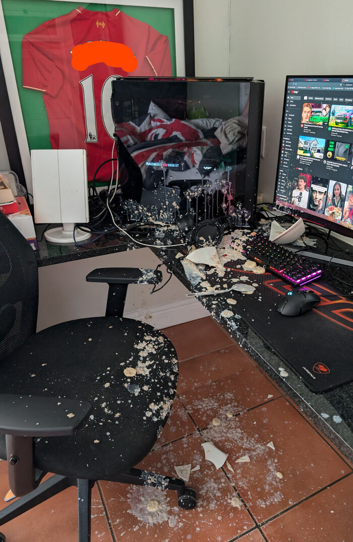 Spilled drink and broken items on a messy desk, reflecting a horrible day scenario.
