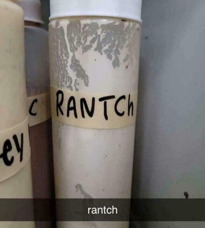 Bottle labeled "RANTCH" in a kitchen setting, showcasing an uninteresting typo.