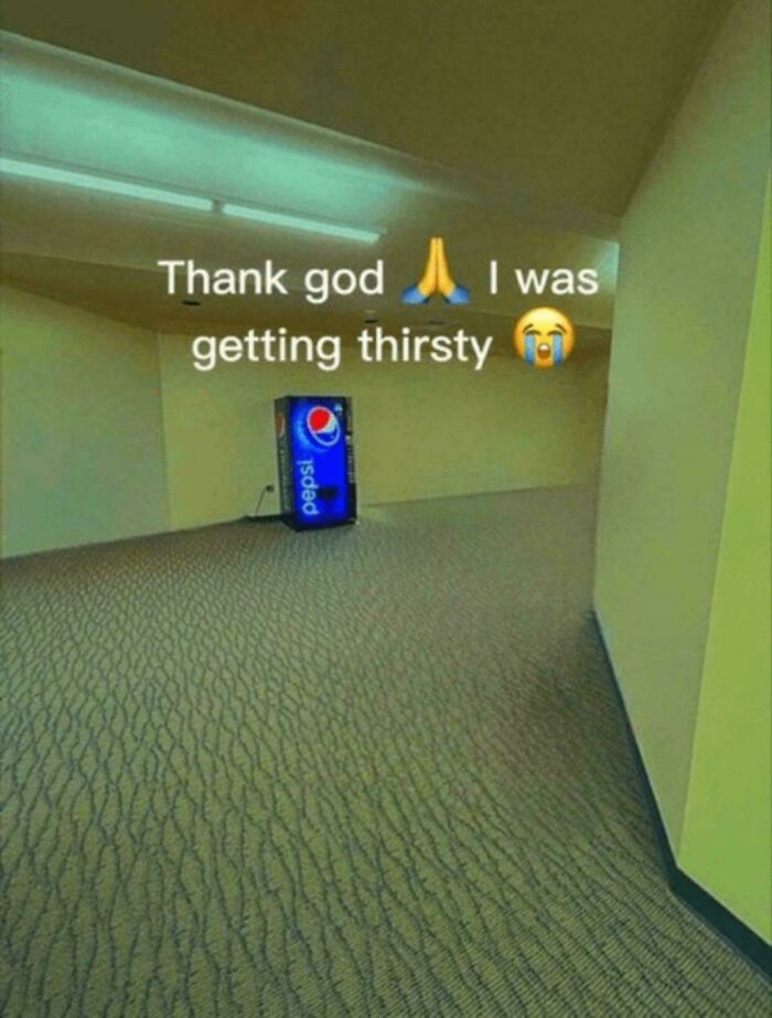 Meme explanation with a lonely Pepsi machine in a vast, empty hallway, captioned "Thank god 🙏 I was getting thirsty 😭."