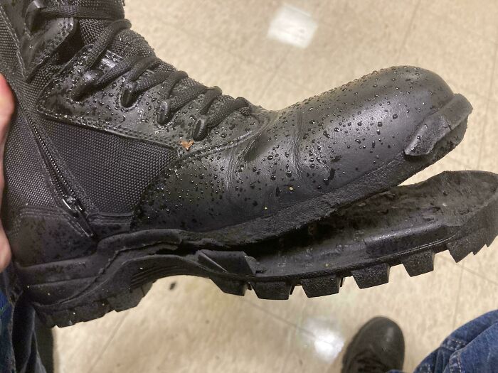 A damaged black boot with a detached sole, highlighting a horrible day moment.