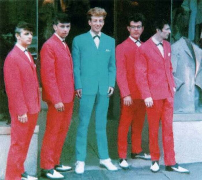 Group of young men in vibrant suits, capturing 1960s American style during the JFK years.