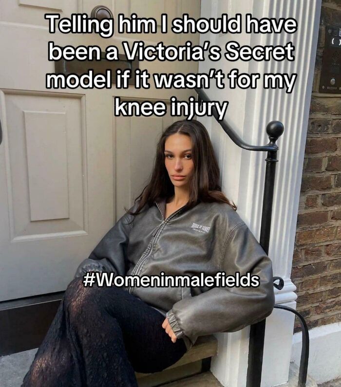 Woman in a leather jacket sitting, with meme text and hashtag, showcasing humor and irony.