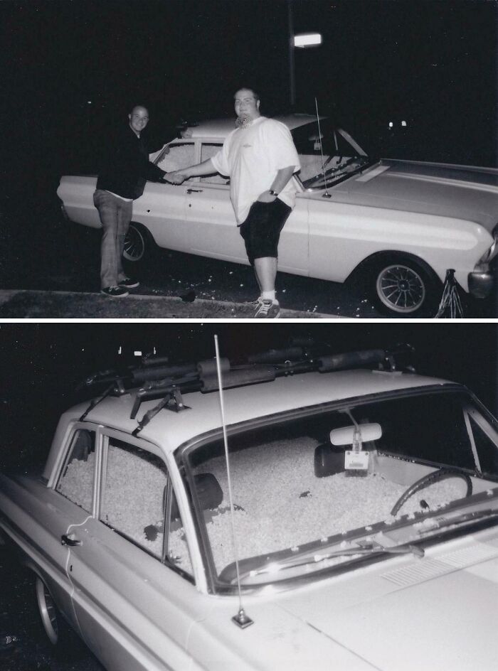 Two men shake hands next to a vintage car filled with popcorn, capturing an unbelievable moment.