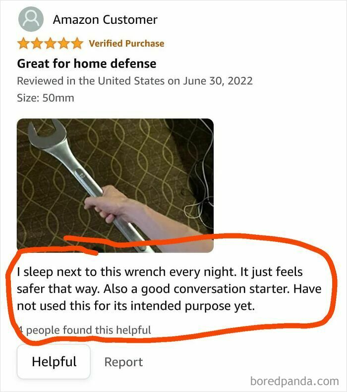 Amazon review showing a person holding a large wrench, humorously used for home defense.