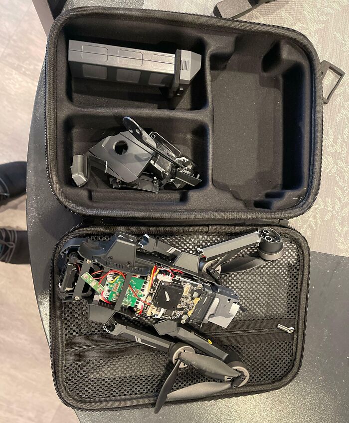 Broken drone in a case, highlighting a day gone wrong.