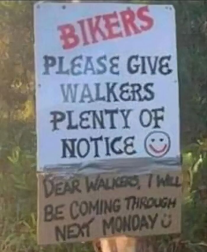 Sign humorously advising bikers and walkers to communicate, highlighting a funny mistake.