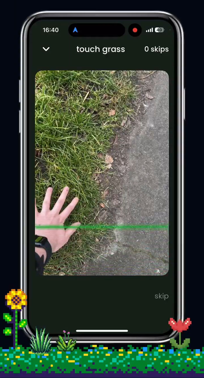 App screen showing a hand on grass, illustrating "touch grass" feature to unblock social media.