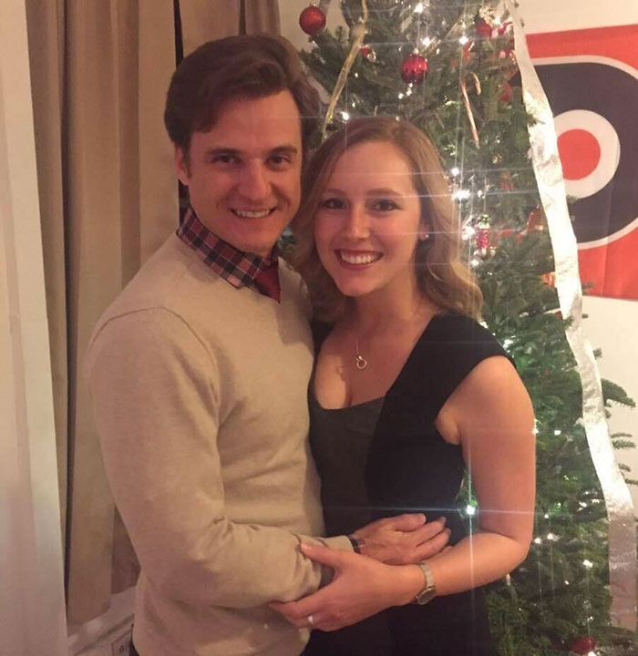 A couple smiling in front of a decorated Christmas tree, related to a doctor and a Hawaii beauty spot incident. A couple smiling in front of a decorated Christmas tree, related to a doctor and a Hawaii beauty spot incident.