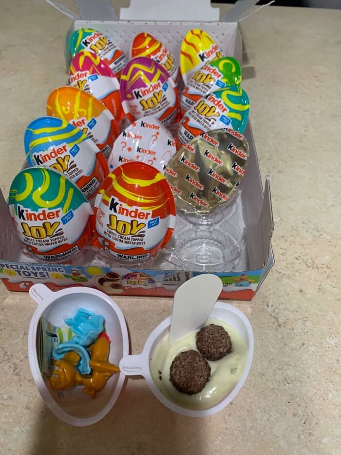 Kinder Joy eggs used as unique Easter basket stuffers, open to show toy and chocolate.