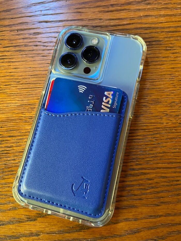 Phone with blue card holder, featuring cards, showcasing a useful travel hack.