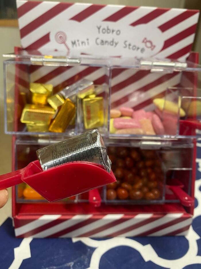 Yobro mini candy store with a red scoop picking up wrapped treats from colorful bins.