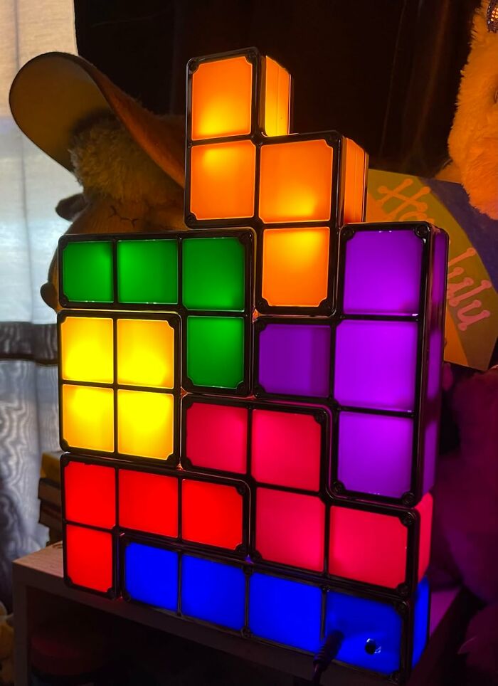 Colorful Tetris-style lamps stacked creatively, challenging self-control with vibrant illuminated blocks.