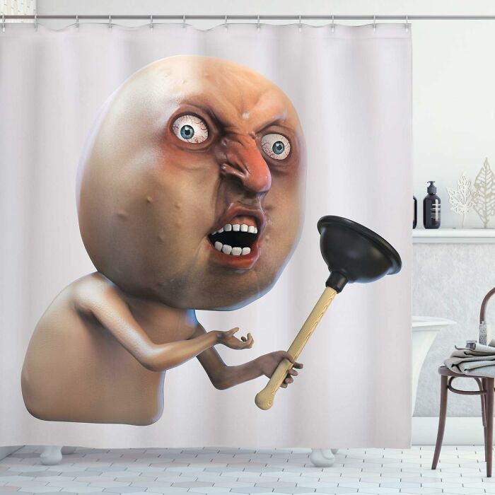 A quirky Amazon find: a shower curtain with a cartoon character holding a plunger in a bathroom setting.