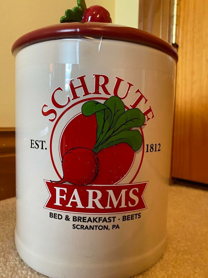 "Schrute Farms jar with beet graphic, featuring fan merch from Amazon store."