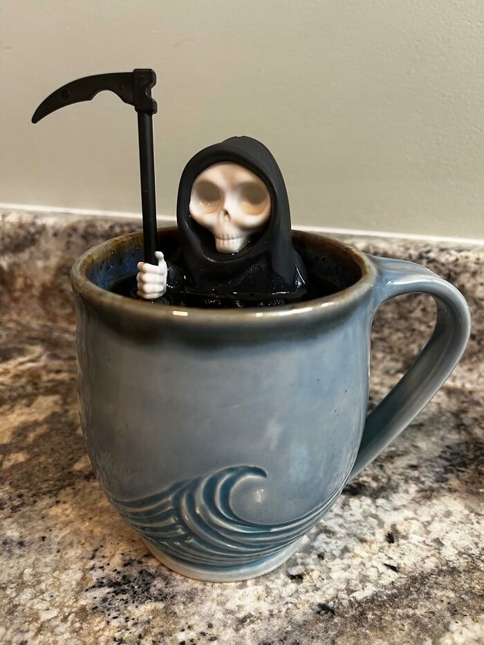 Grim reaper figurine in a mug, one of the random Amazon finds sparking joy.