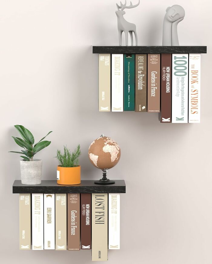 Floating bookshelves displaying books, plants, and decorative items, illustrating creative ways to store sentimental clutter.