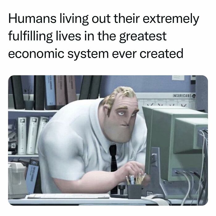 Man from old cartoon looking bored at computer, with sarcastic caption about economic systems.