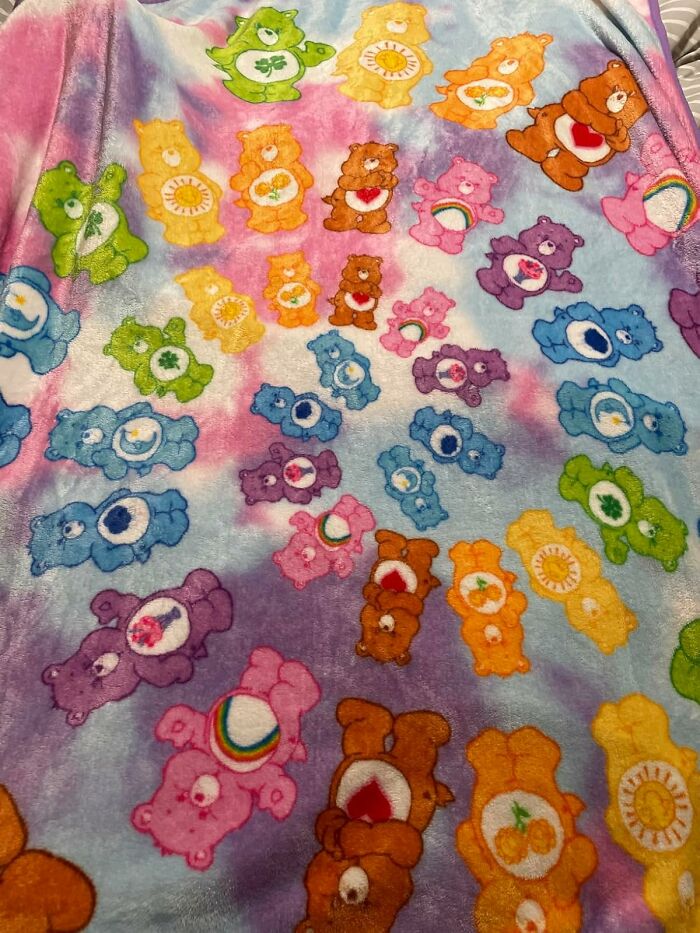 Colorful blanket with cartoon bears, reminiscent of 80s childhood treasures.