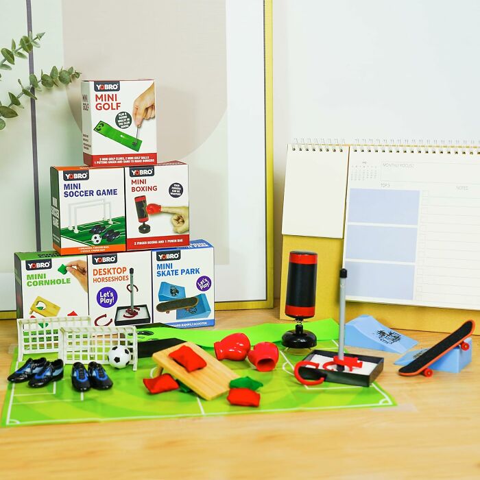 Yobro mini games collection on desk, including boxing, skate park, and soccer set.