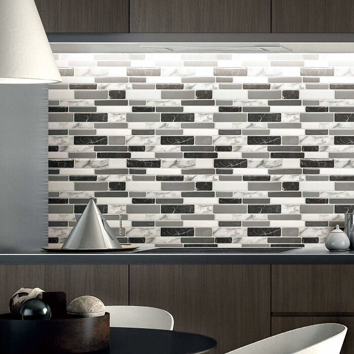 "Modern kitchen backsplash featuring simple DIY home project with geometric tile design and monochrome palette."