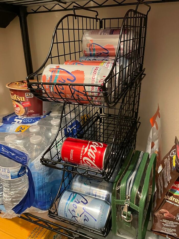 Cans of LaCroix and Coke organized in a black wire rack, beside bottled water and snacks, illustrating managing a Costco a*******n.