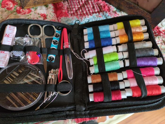 Sewing kit with colorful threads, scissors, and needles, illustrating essential life skills mastery.