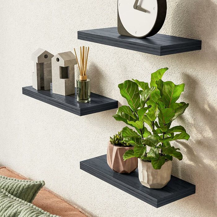 Floating shelves with plants and decor showcasing spring discounts on Amazon deals.