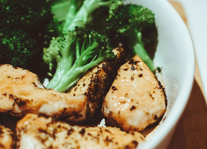 Grilled chicken and broccoli in a bowl, representing a bland "white people meal". Grilled chicken and broccoli in a bowl, representing a bland "white people meal".