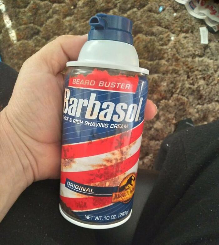 Hand holding a can of Barbasol shaving cream, illustrating a 'lifetime supply' winner's experience.