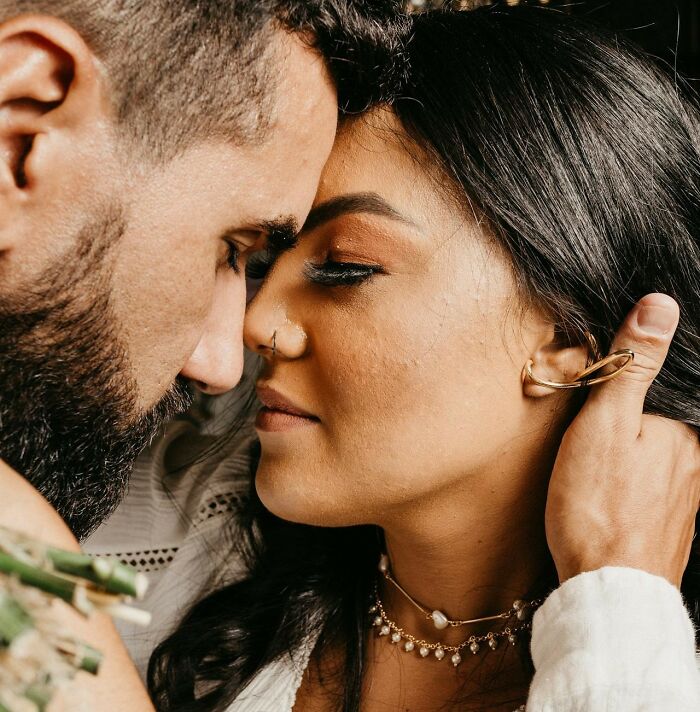 Couple sharing an intimate moment at their wedding, close-up shot showing emotional connection.