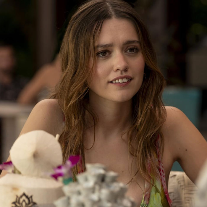 Aimee Lou Wood at a cafe table, responding to comments on her teeth.