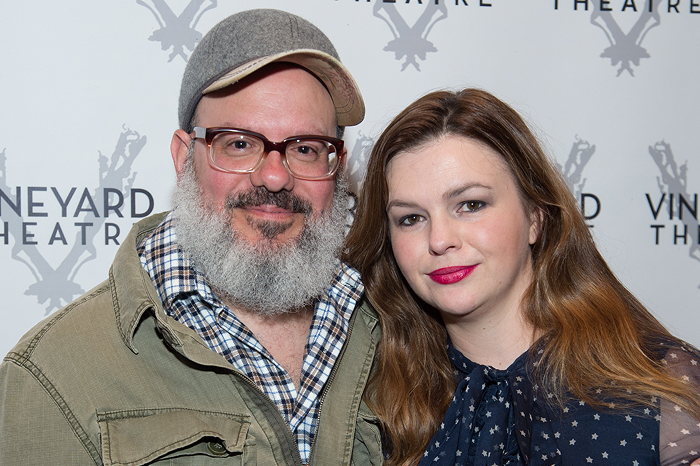 Amber Tamblyn and David Cross smiling at a theater event backdrop.