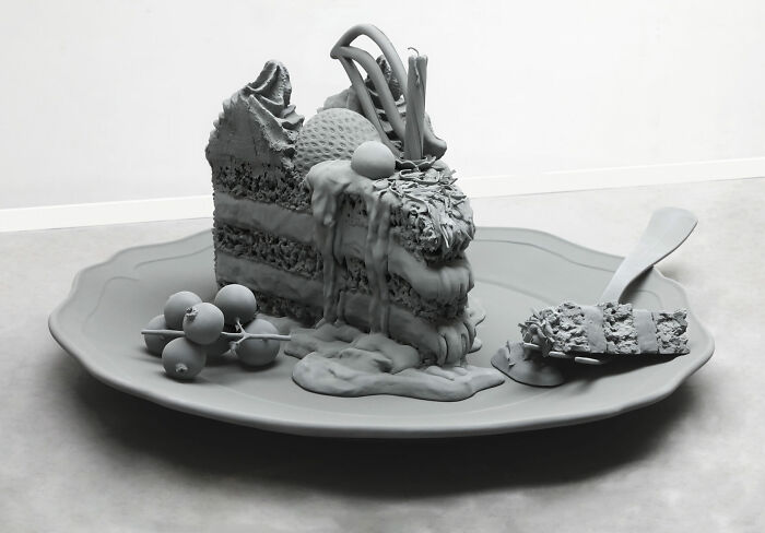 Monochrome sculpture of a dessert by Hans Op De Beeck, featuring a cake slice on a plate with blueberries and a fork.